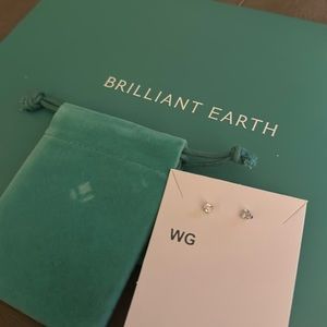 Brand new white gold .20 diamond stud earrings